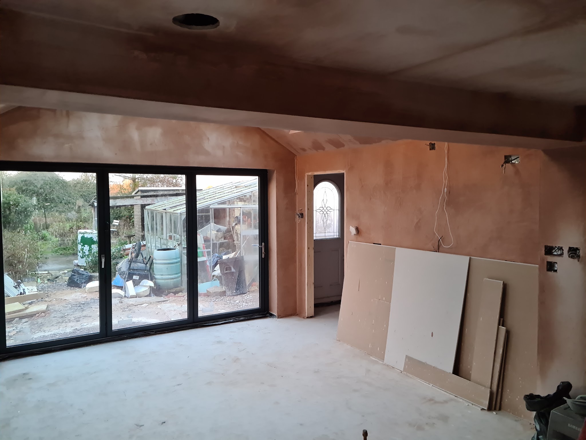 Freshly plastered extension with bifold doors to the garden