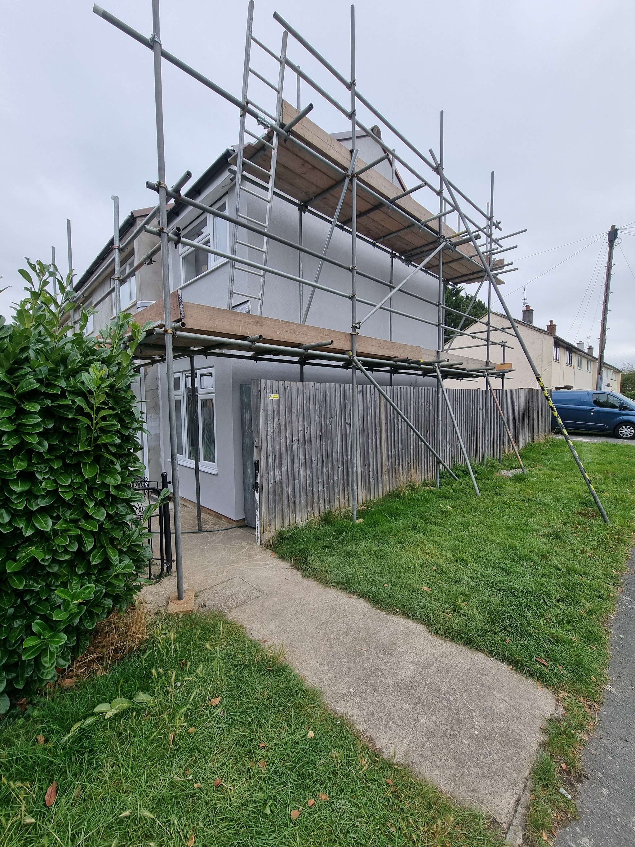 House wrapped in scaffolding ready for rendering