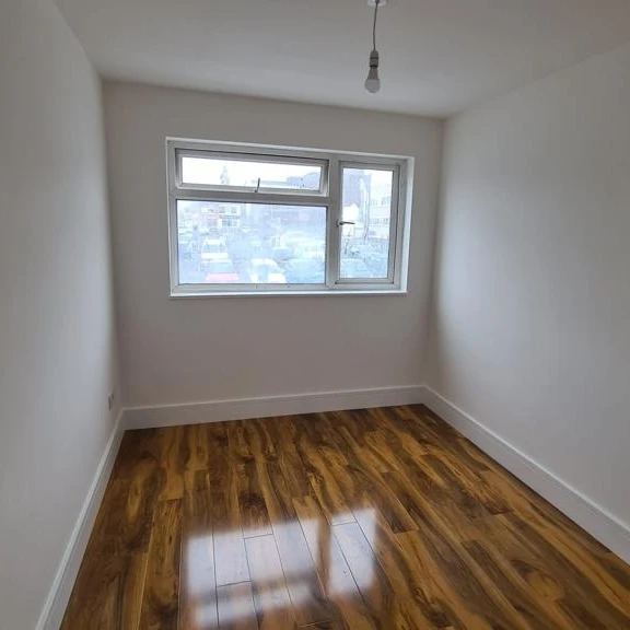 Finished bedroom with smooth white walls